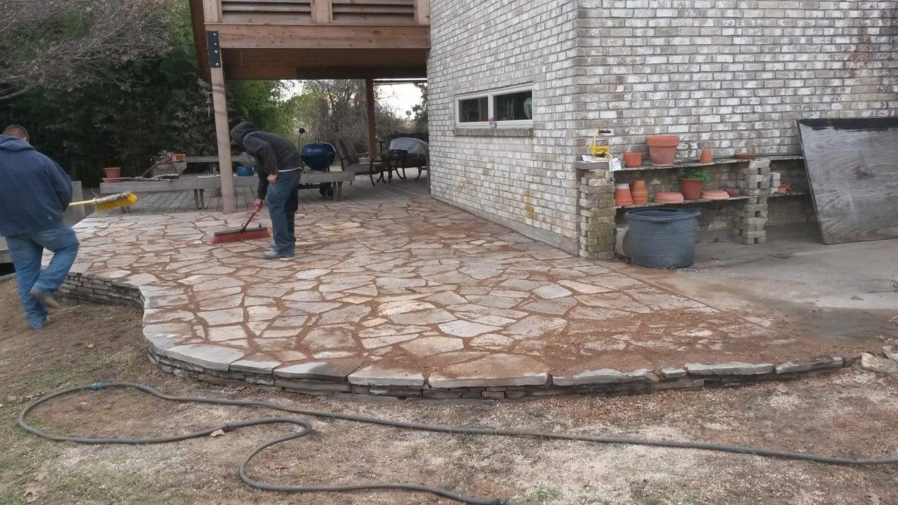Flagstone patio being finished near New Ulm, TX
