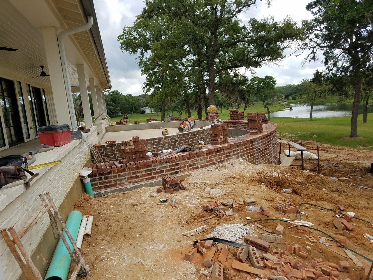 Curved brick wall under construction near Fayetteville, TX