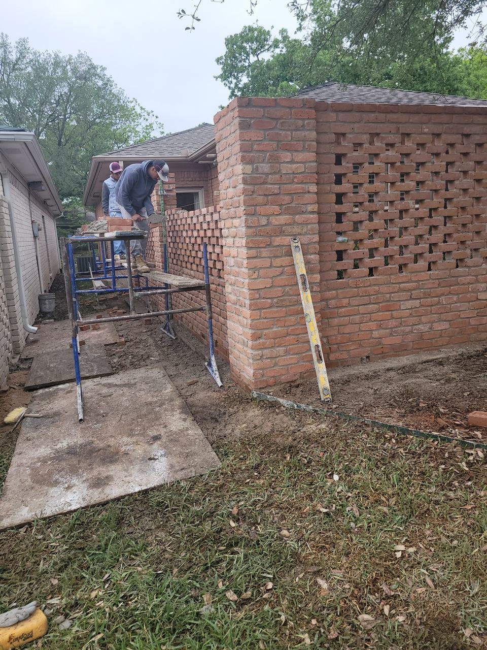 Brick privacy wall with a decorative open pattern in College Station, TX