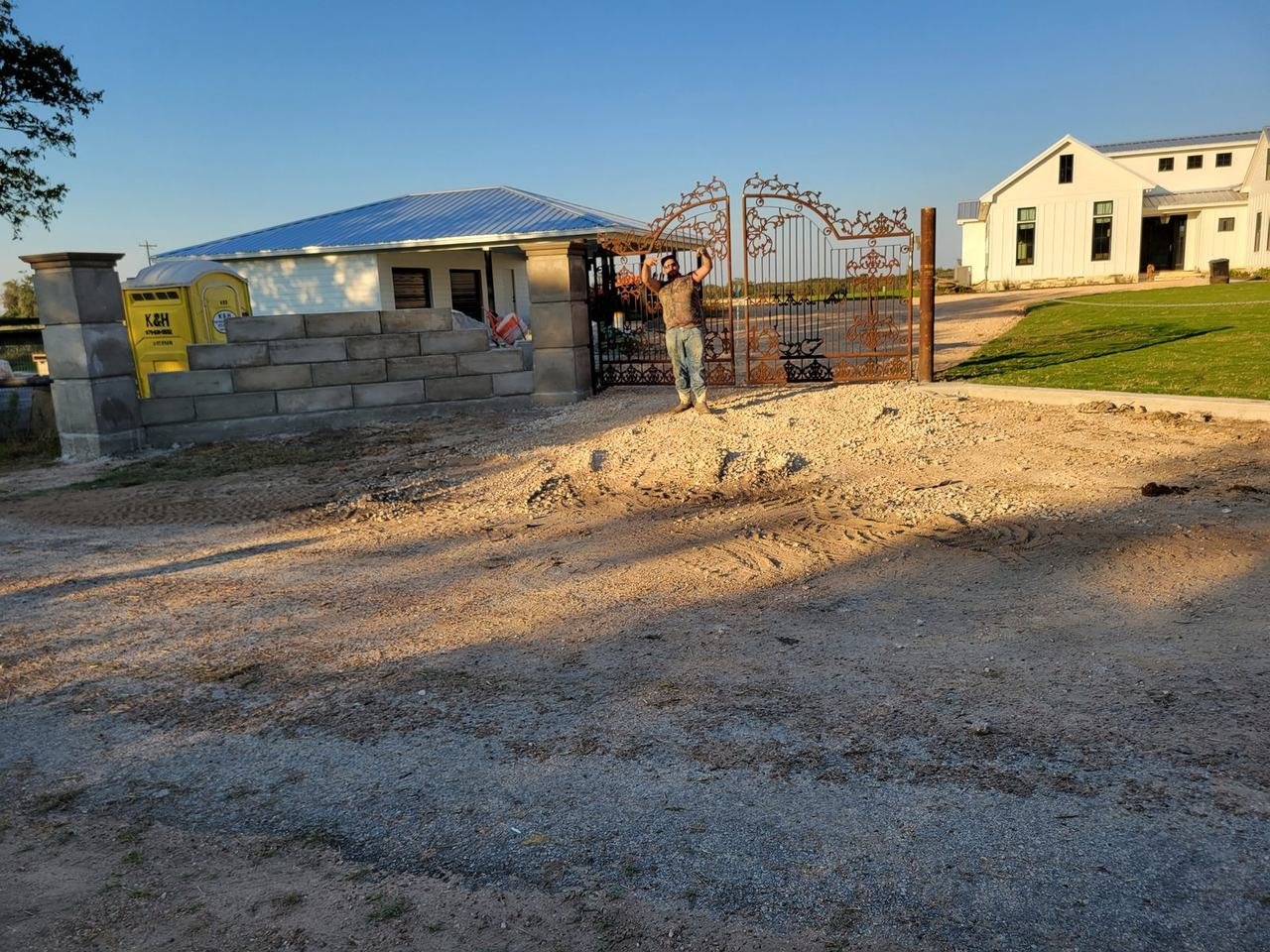 Block wall and stone columns at a ranch driveway entrance near Fayetteville, TX