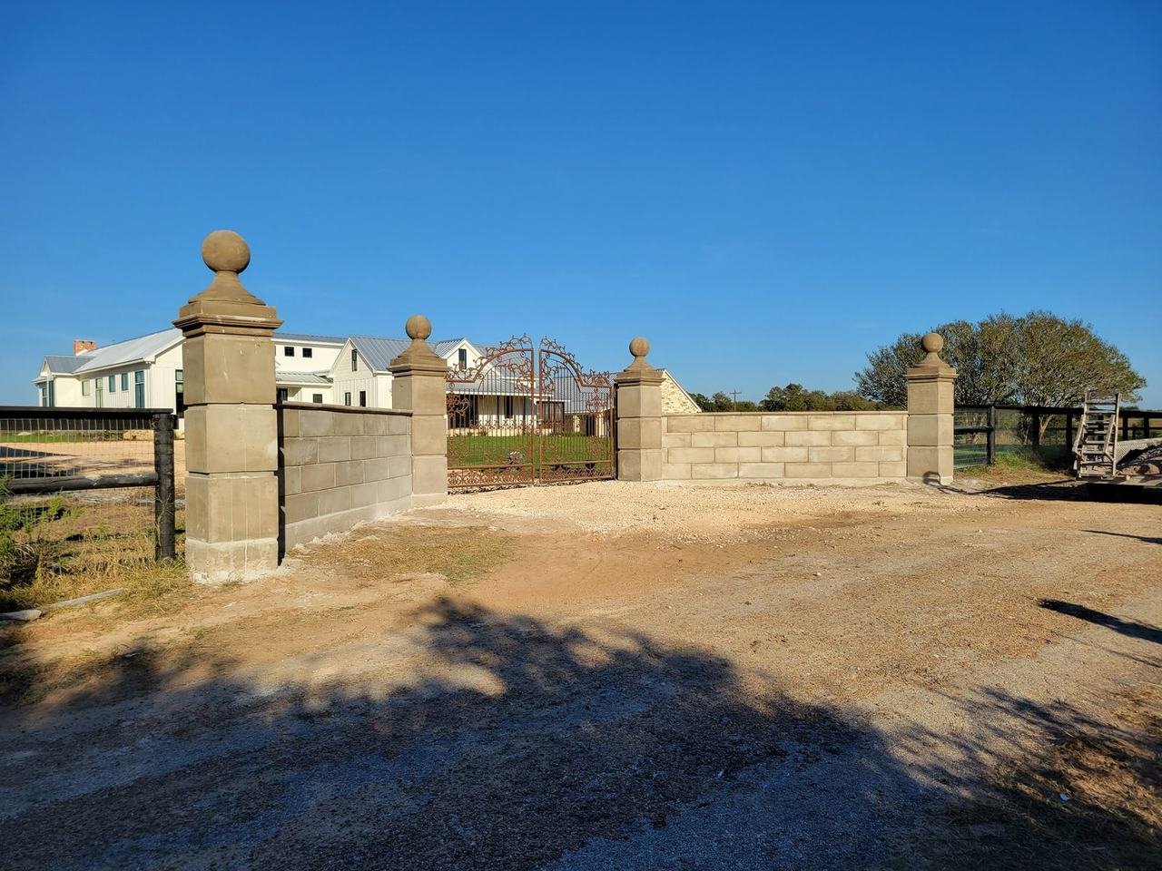 Finished stone-capped entrance columns near Fayetteville, TX