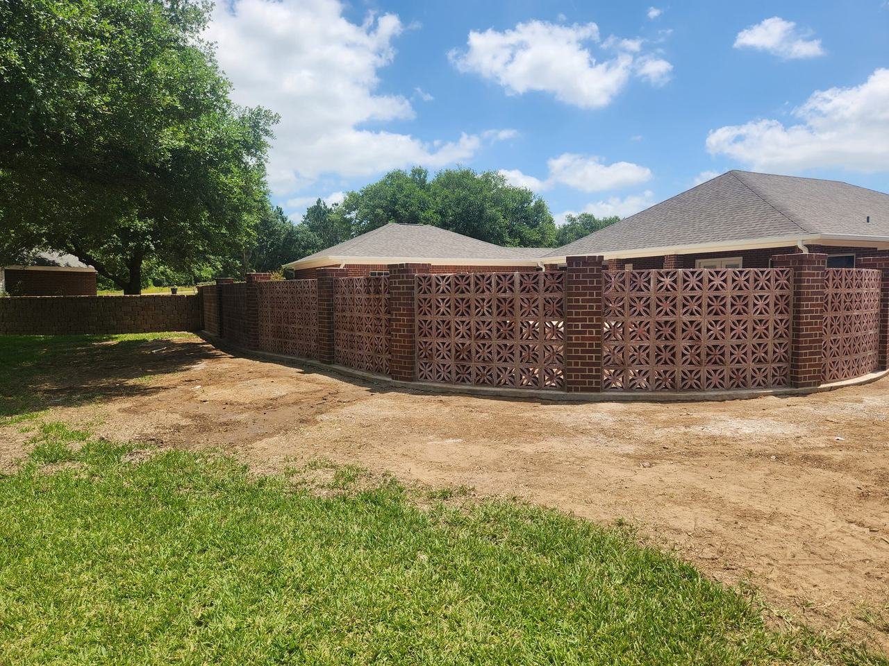 Brick wall with an open pattern around a backyard in Bellville, TX