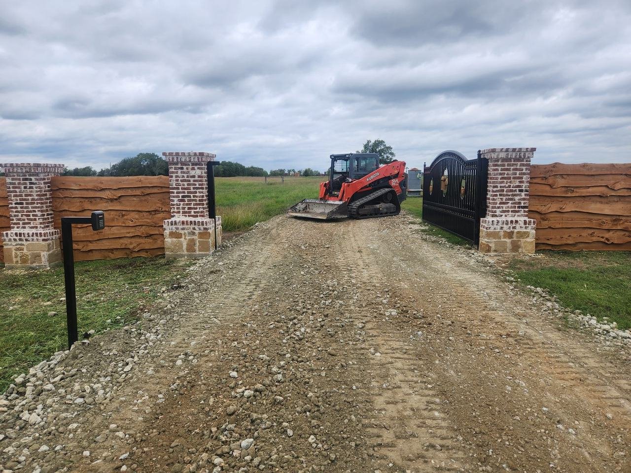 Brick columns beside an entrance gate in Caldwell, TX