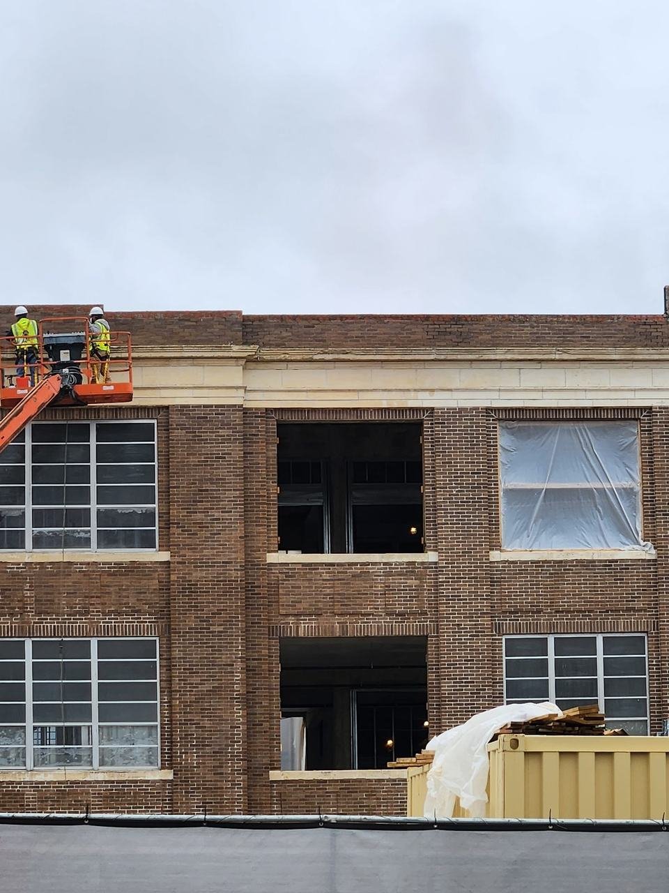 Brick work on an upper floor of a large building in Cameron, TX