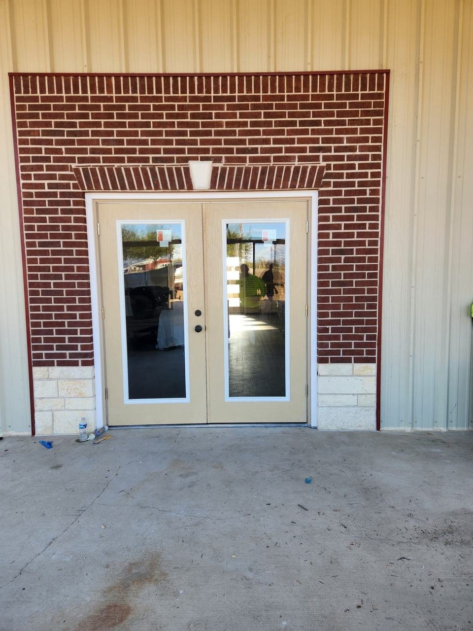 Brick wall around French doors in Caldwell, TX