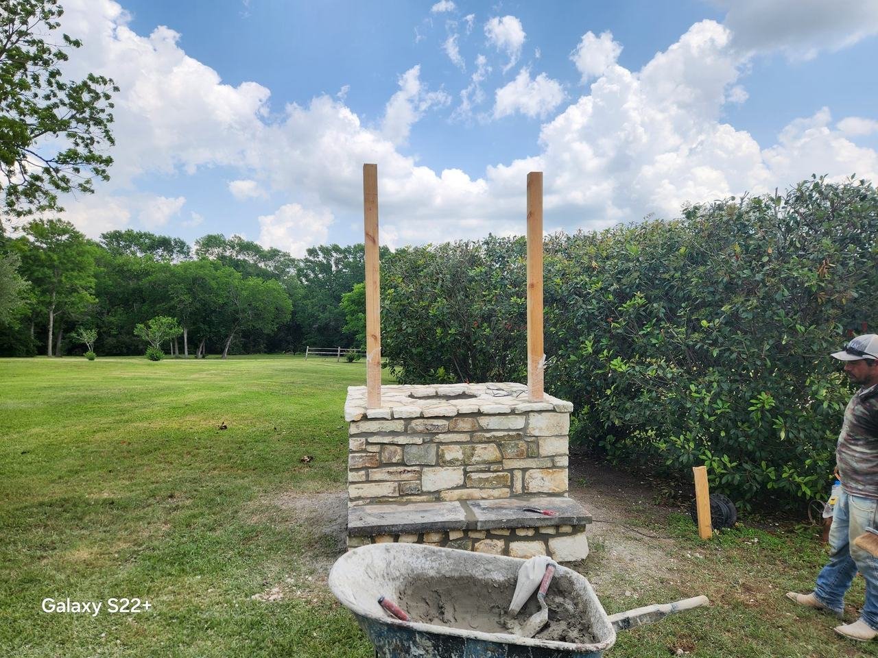 Natural stone structure with posts in a field near New Ulm, TX