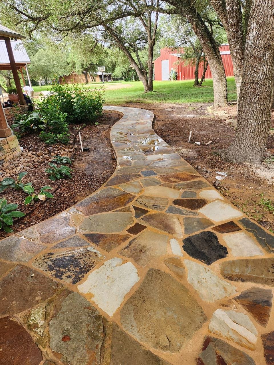 Winding flagstone path under oak trees near Round Top, TX