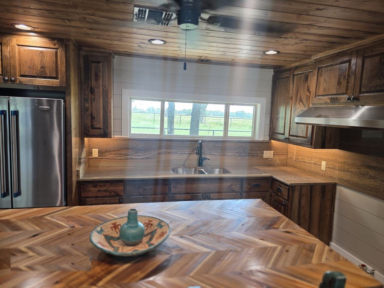 Natural stone slab countertop and backsplash in a kitchen in Giddings, TX