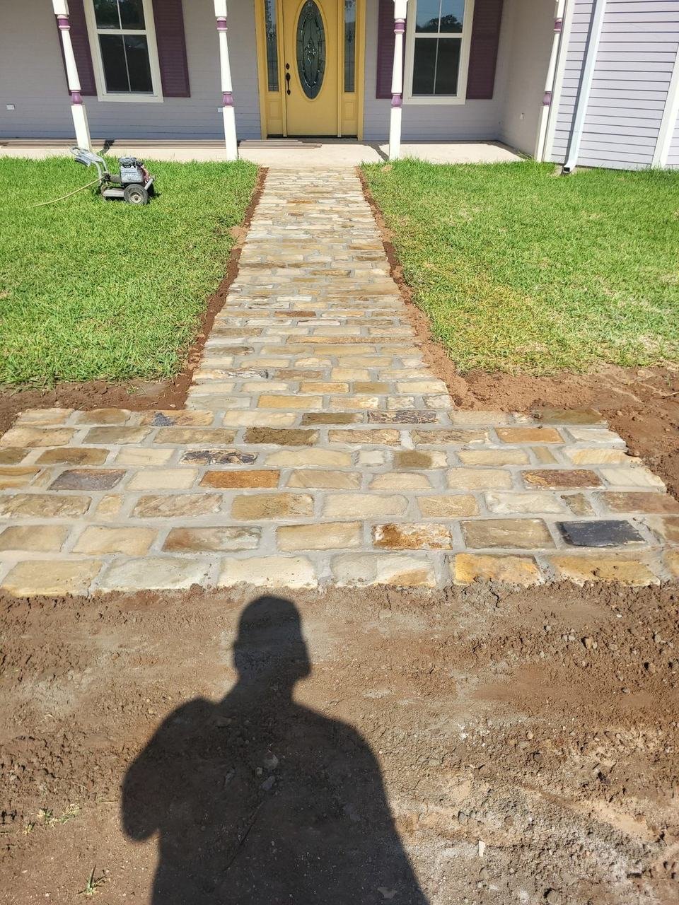 Flagstone walkway leading to a front door near Fayetteville, TX
