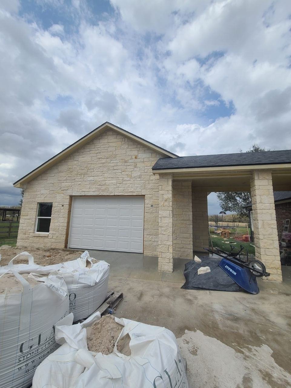 Finished stone siding on a shop building in College Station, TX